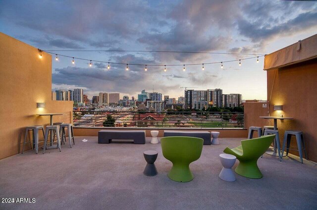 view of patio / terrace with a view of city, outdoor dry bar, and a balcony