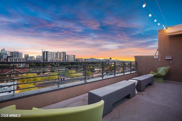 view of balcony at dusk