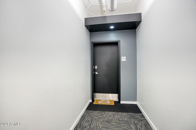 interior space featuring baseboards