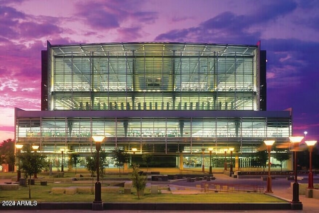 view of outdoor building at dusk