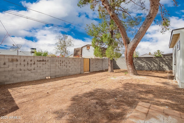 view of yard with a fenced backyard