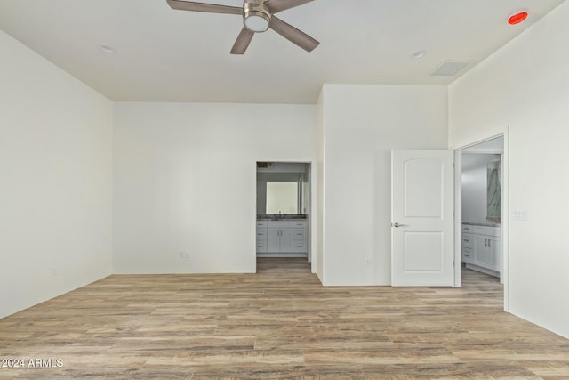 unfurnished room with ceiling fan and light hardwood / wood-style flooring