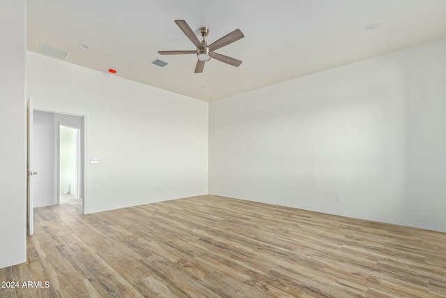 spare room with ceiling fan and light hardwood / wood-style flooring