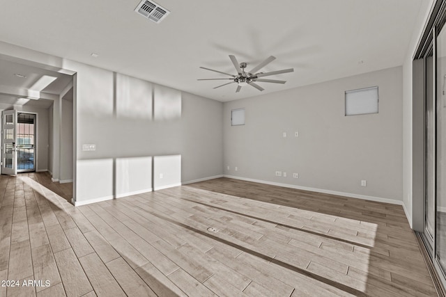 spare room with ceiling fan and light hardwood / wood-style floors