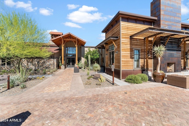 view of front of property featuring exterior fireplace