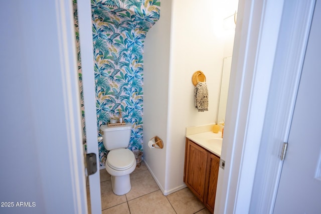 16021 N 30th St Unit 127, Phoenix, AZ 85032 - bathroom featuring vanity, toilet, tile patterned floors, baseboards, and wallpapered walls