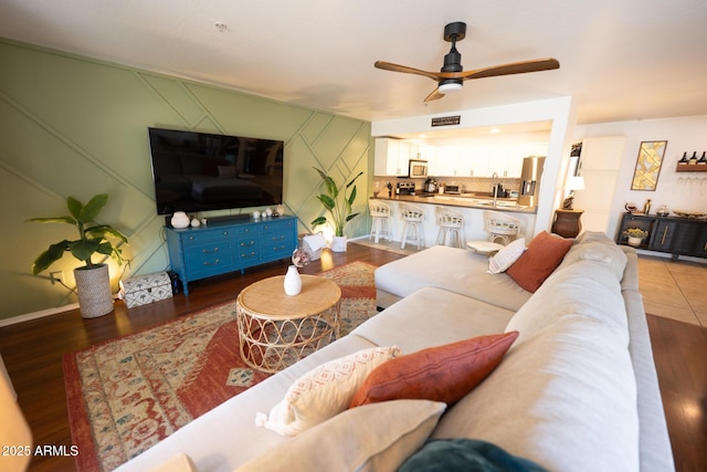 16021 N 30th St Unit 127, Phoenix, AZ 85032 - living area featuring a ceiling fan and wood finished floors