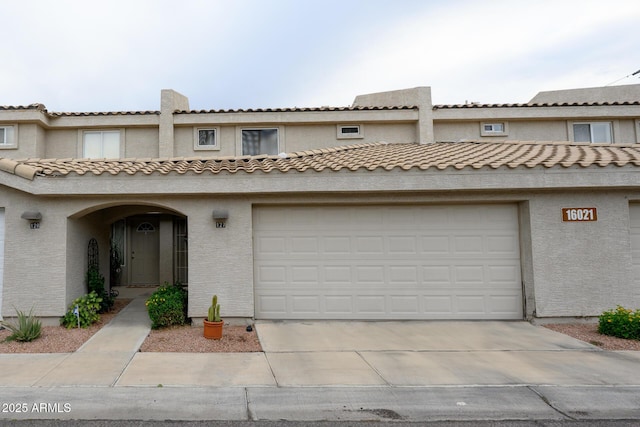 16021 N 30th St Unit 127, Phoenix, AZ 85032 - townhome / multi-family property featuring driveway and stucco siding