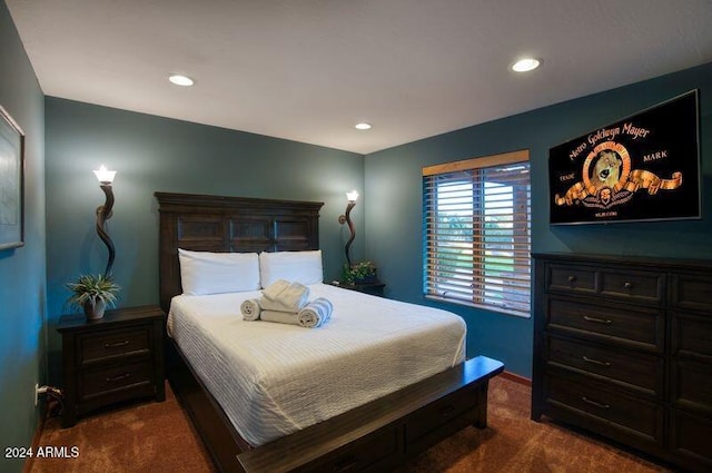 bedroom with dark colored carpet, baseboards, and recessed lighting