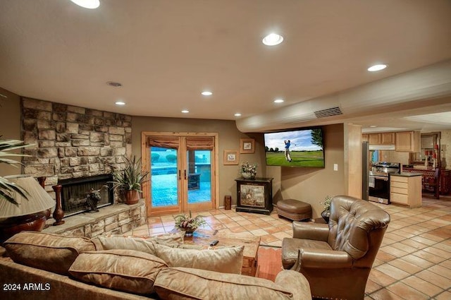 living room with recessed lighting, visible vents, and a fireplace