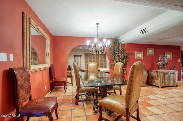 dining room featuring a notable chandelier, visible vents, arched walkways, and light tile patterned floors