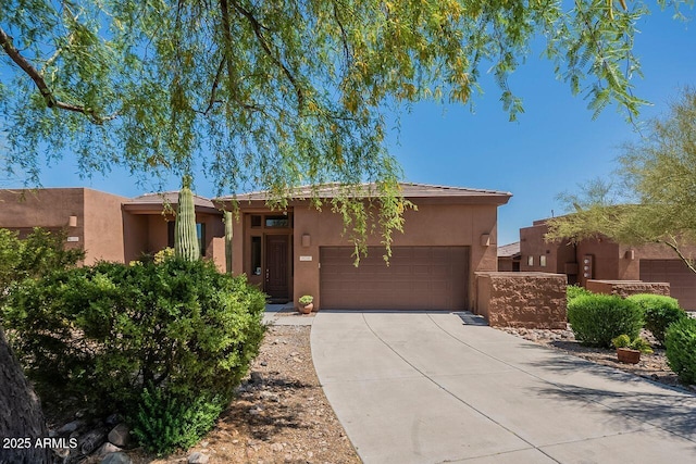 16248 E Ridgeline Dr, Fountain Hills, AZ 85268 - view of front facade featuring stucco siding, an attached garage, and concrete driveway