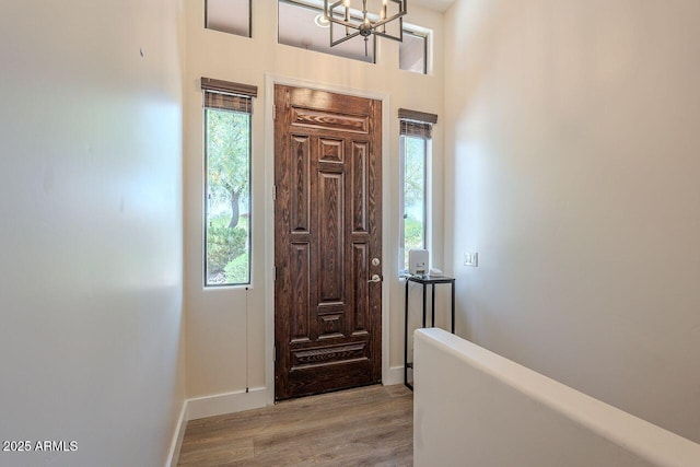 16248 E Ridgeline Dr, Fountain Hills, AZ 85268 - foyer with light wood-style floors, plenty of natural light, and a notable chandelier