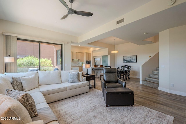 16248 E Ridgeline Dr, Fountain Hills, AZ 85268 - living area with baseboards, visible vents, a ceiling fan, wood finished floors, and stairway