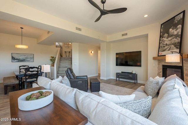 16248 E Ridgeline Dr, Fountain Hills, AZ 85268 - living area with ceiling fan, wood finished floors, stairs, and visible vents