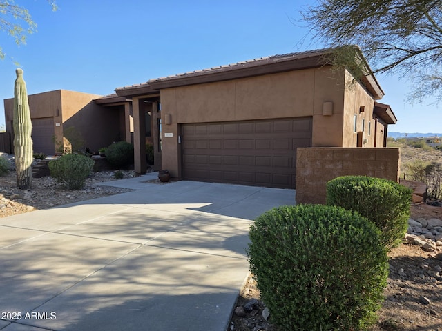 16248 E Ridgeline Dr, Fountain Hills, AZ 85268 - view of front facade with an attached garage, driveway, and stucco siding