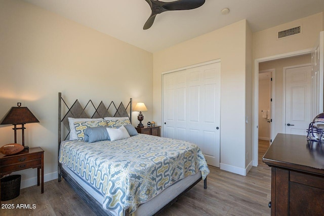 16248 E Ridgeline Dr, Fountain Hills, AZ 85268 - bedroom with baseboards, wood finished floors, visible vents, and a closet