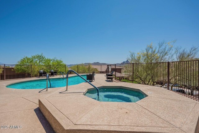 16248 E Ridgeline Dr, Fountain Hills, AZ 85268 - view of swimming pool with fence, a patio, a fenced in pool, and an in ground hot tub