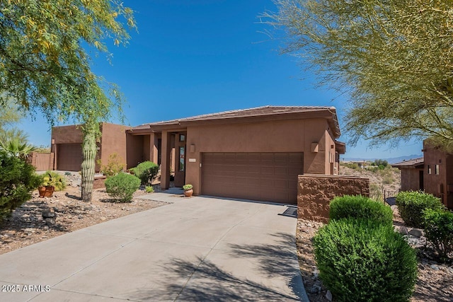 16248 E Ridgeline Dr, Fountain Hills, AZ 85268 - view of front facade featuring a garage, driveway, stucco siding, and fence