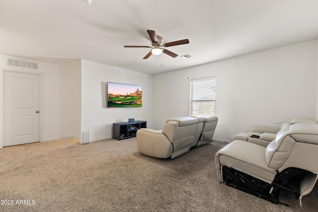 living area with visible vents, carpet floors, baseboards, and a ceiling fan