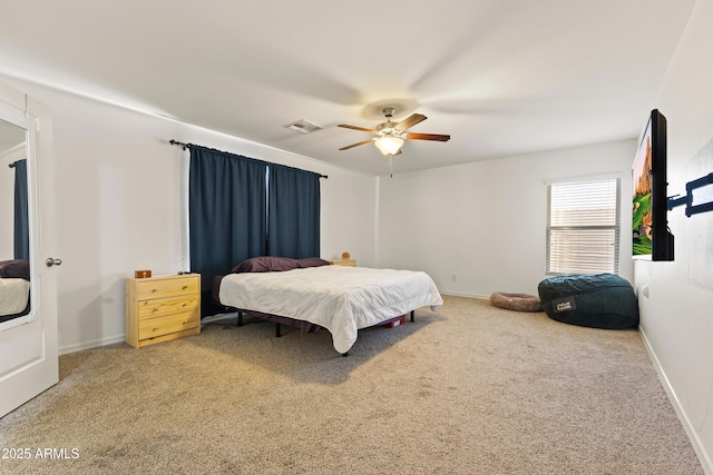 bedroom featuring ceiling fan, carpet, visible vents, and baseboards