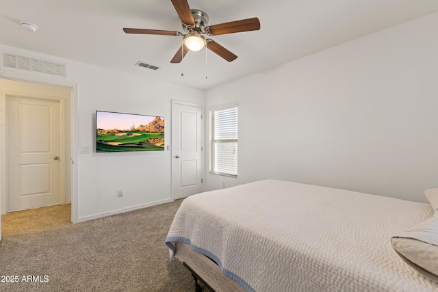 carpeted bedroom with visible vents, ceiling fan, and baseboards