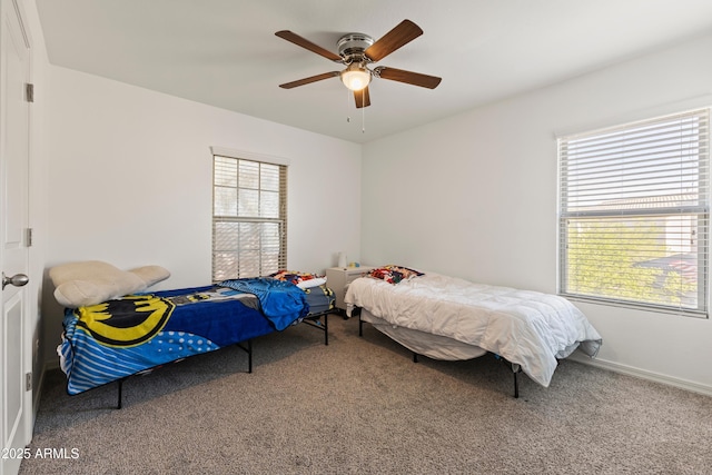 bedroom featuring baseboards, carpet, and ceiling fan