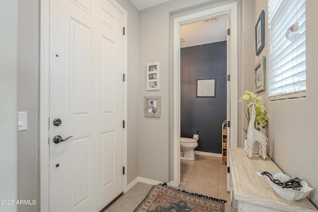 interior space featuring tile patterned floors, toilet, and vanity