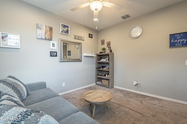 carpeted living room featuring ceiling fan