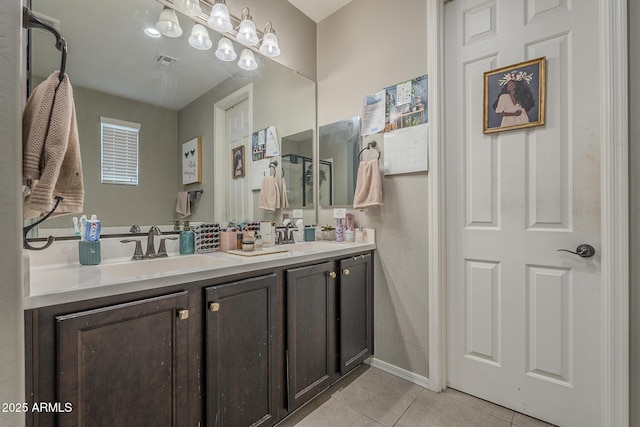 bathroom with vanity and tile patterned flooring