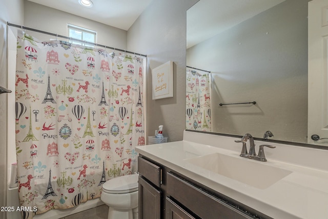 full bathroom featuring vanity, toilet, and shower / tub combo