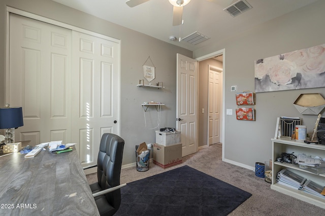 home office with ceiling fan and carpet flooring