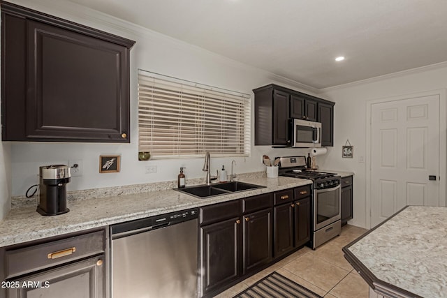 kitchen featuring light tile patterned flooring, recessed lighting, stainless steel appliances, a sink, and ornamental molding