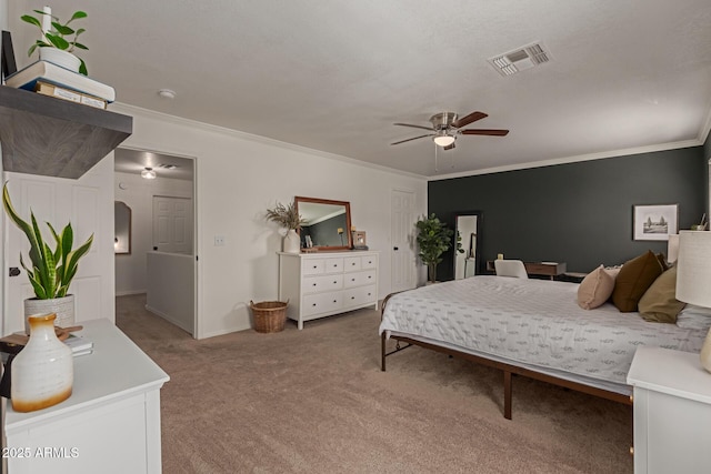 carpeted bedroom with baseboards, ceiling fan, visible vents, and crown molding