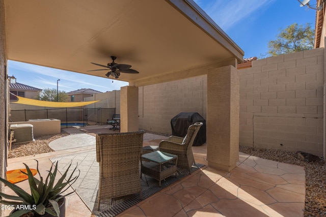 view of patio / terrace featuring ceiling fan and a fenced backyard