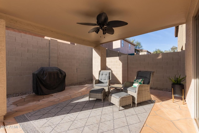 view of patio / terrace with a fenced backyard, ceiling fan, and area for grilling