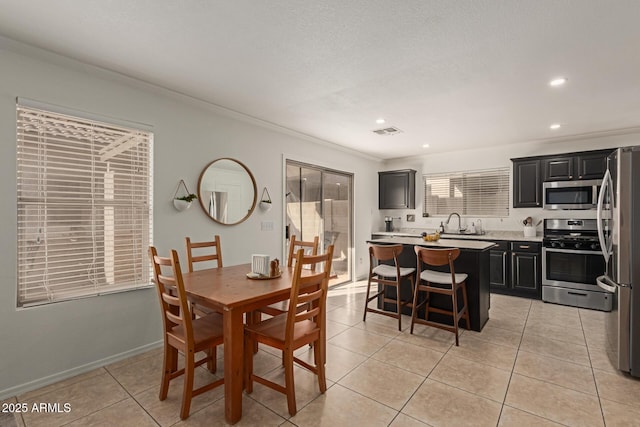 dining room featuring light tile patterned flooring, recessed lighting, visible vents, baseboards, and ornamental molding