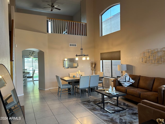 living room featuring ceiling fan and light tile patterned floors