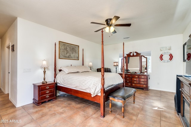 bedroom featuring visible vents, baseboards, ceiling fan, and light tile patterned flooring