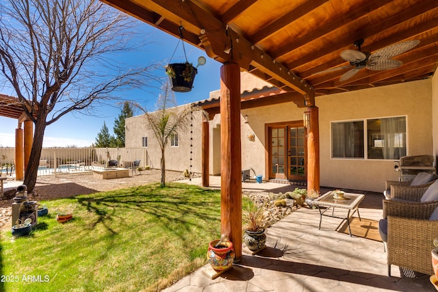 view of yard featuring a ceiling fan, a patio, and fence