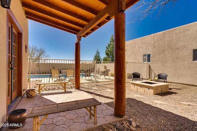 view of patio featuring a fenced in pool and fence