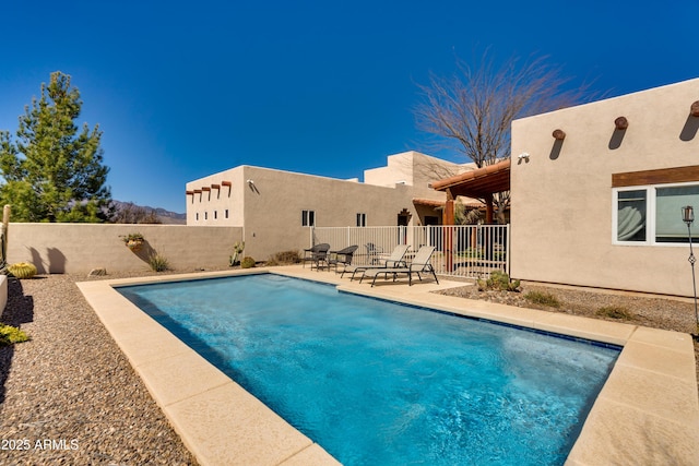 view of pool with a patio area, a fenced in pool, and a fenced backyard