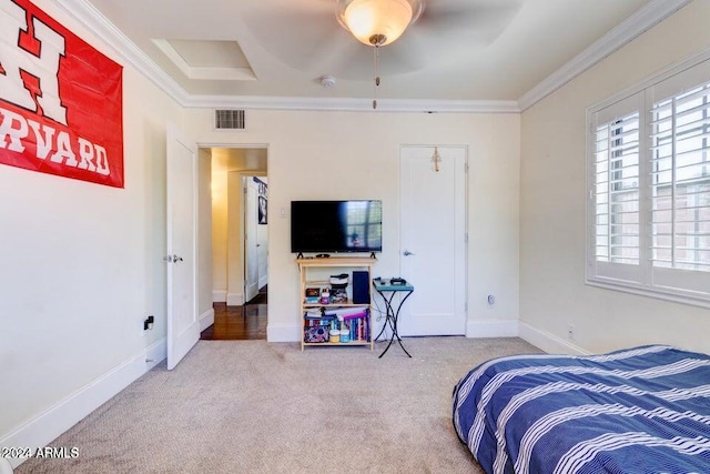 bedroom featuring ceiling fan, crown molding, and carpet