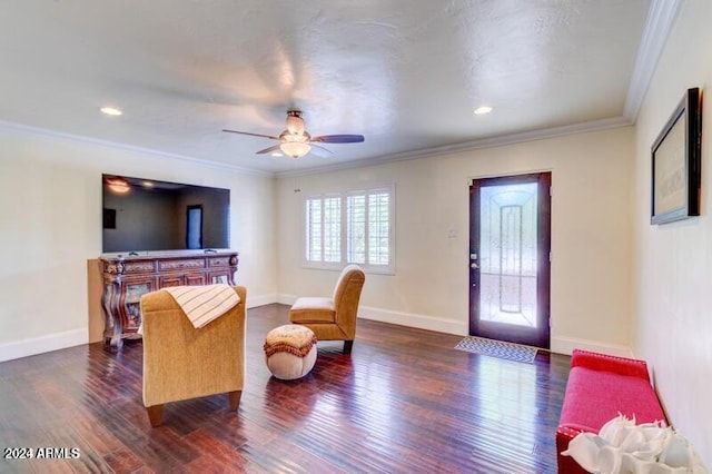 living room with ceiling fan, dark hardwood / wood-style floors, and crown molding