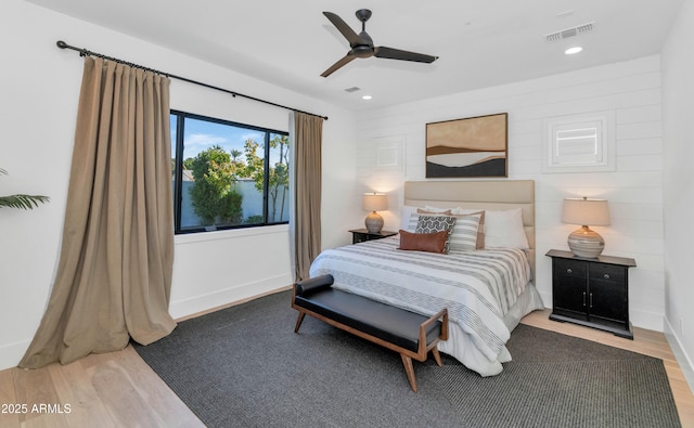 bedroom with ceiling fan and wood-type flooring