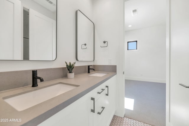 bathroom with tile patterned flooring and vanity