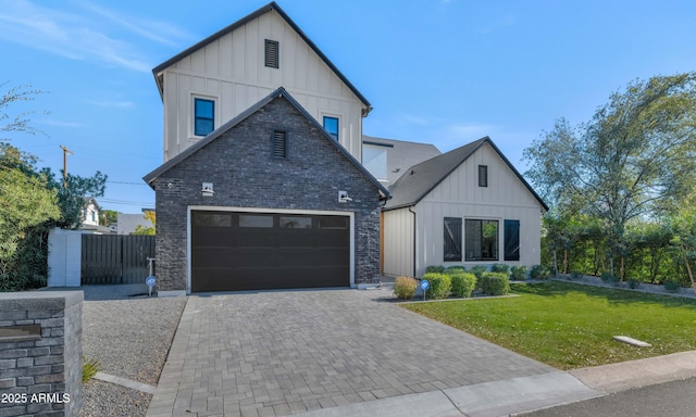 modern inspired farmhouse featuring a front yard and a garage