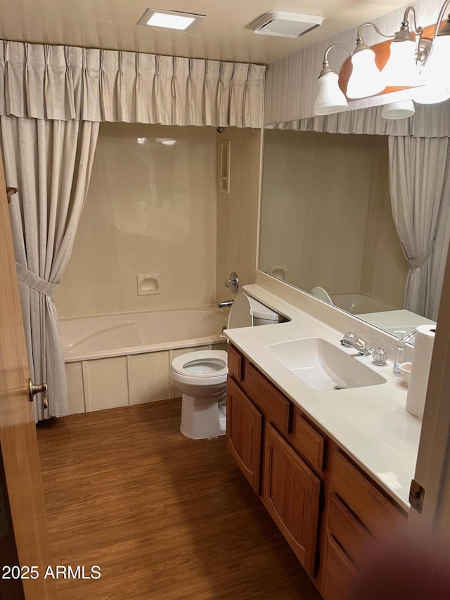 6223 N 12th St Unit 1, Phoenix, AZ 85014 - full bathroom with wood finished floors, vanity, and shower / bath combo with shower curtain