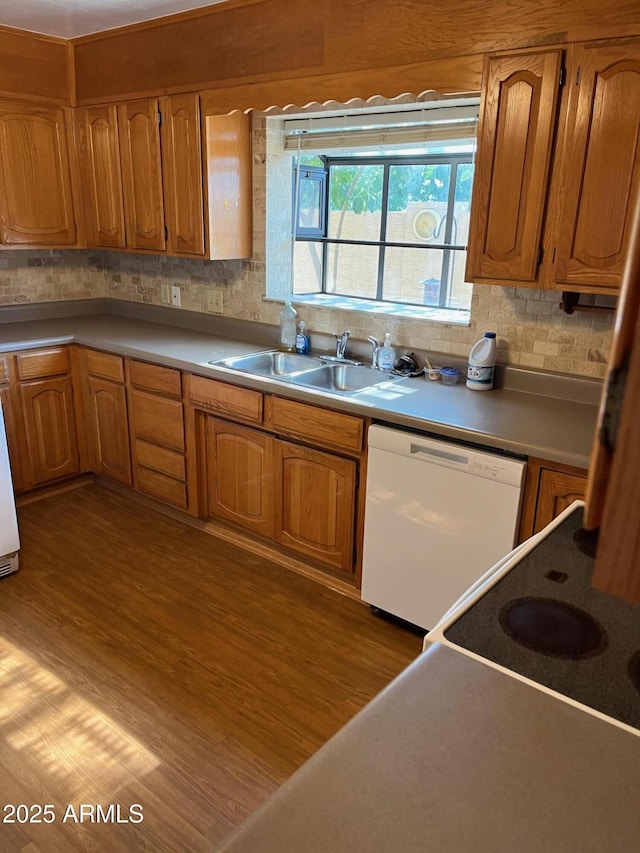 6223 N 12th St Unit 1, Phoenix, AZ 85014 - kitchen featuring white dishwasher, backsplash, light wood-style floors, and brown cabinetry