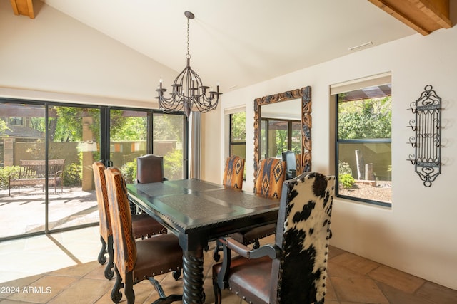 dining area featuring vaulted ceiling with beams, light tile patterned floors, and an inviting chandelier